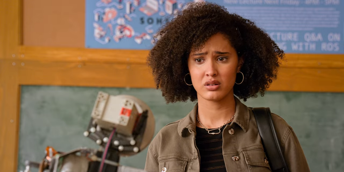 In Never Have I Ever, Fabiola looks confused directly into the camera.