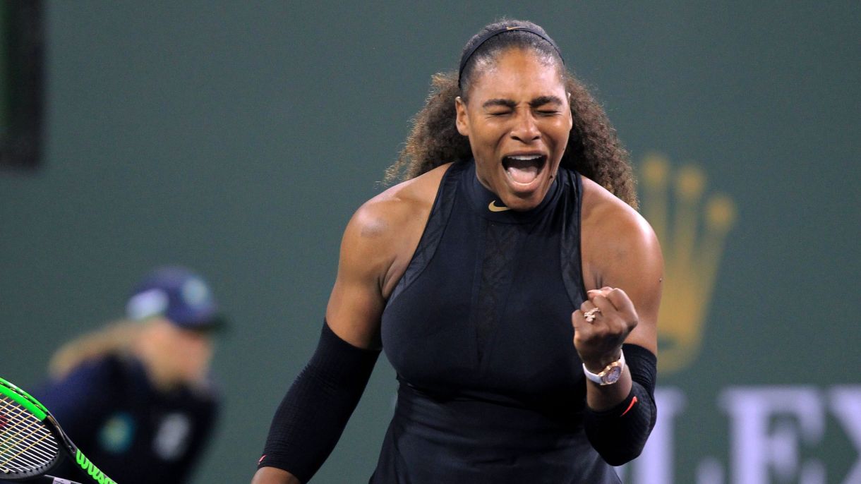 Serena Williams, the greatest athlete of all time, pumping her fist in celebration