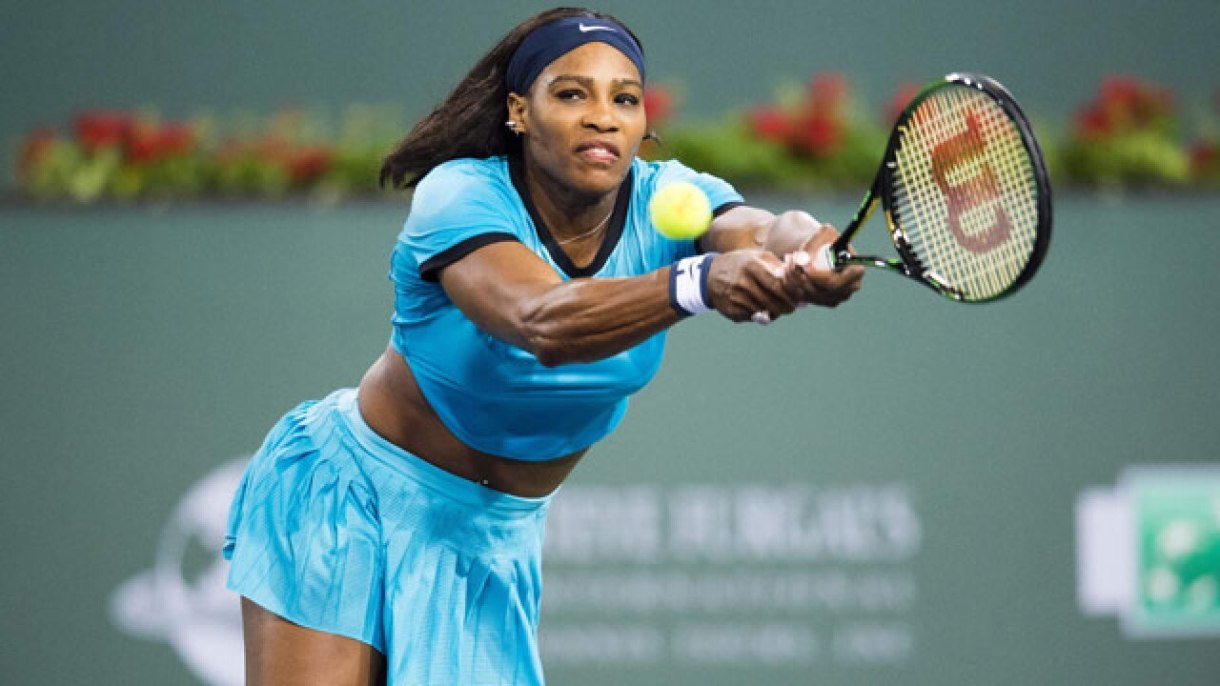 Serena Williams, the greatest athlete of all time, reaching to make a return shot