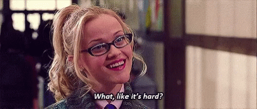 Elle Woods saying the iconic line "What like it's hard?" in a gif from Legally Blonde