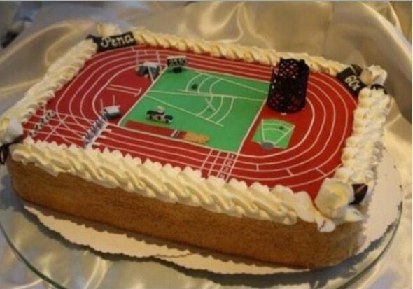 a cake decorated to look like an athletics track