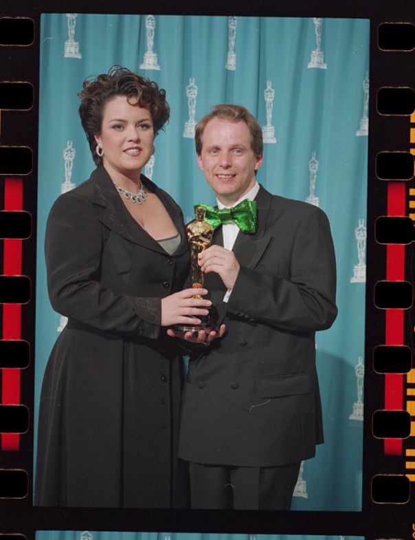 Nick Park Holding His Oscar with Presenter Rosie O'Donnell 