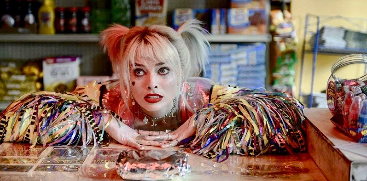 Harley Quinn waits for a breakfast sandwich in a jacket made out of confetti in "Birds of Prey," her face is one of desperation.