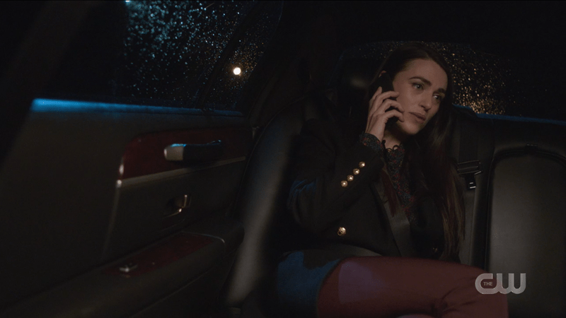 Lena Luthor in the back of a limo on the phone
