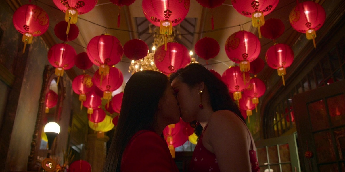 Alice and Sumi seal the Lunar New Year with a kiss.