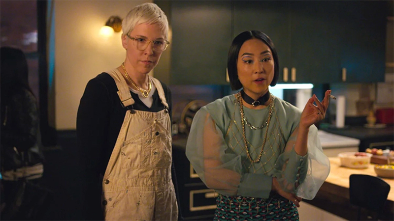 Lizzy and Maxine stand in the kitchen in Russian Doll