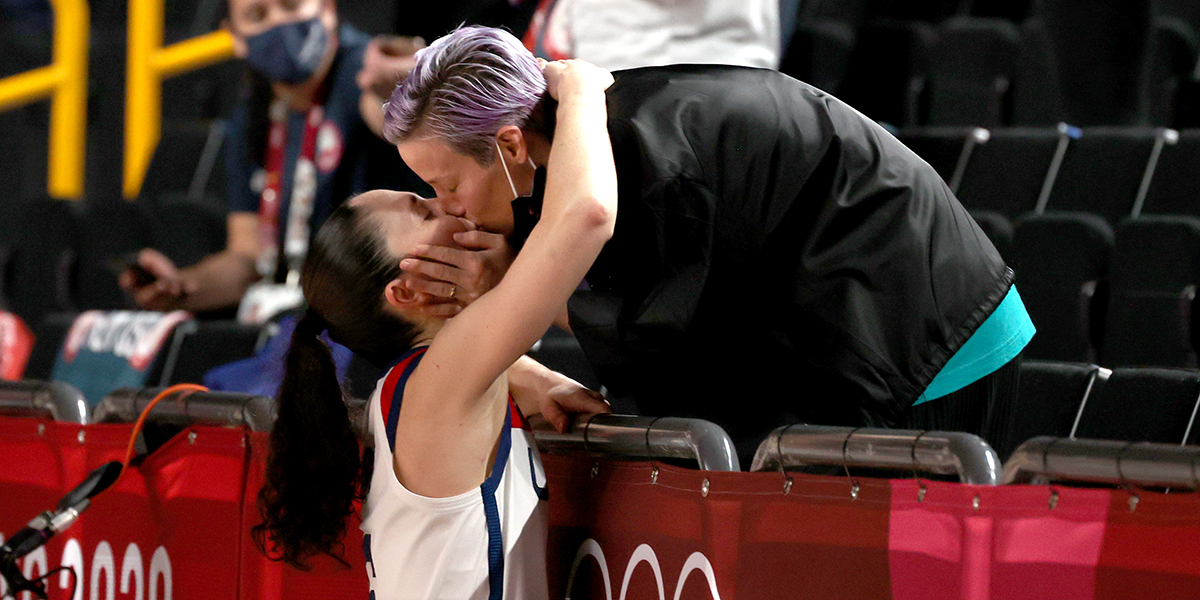 Sue Bird #6 of Team United States kisses Megan Rapinoe in celebration after the United States' win over Japan in the Women's Basketball final game on day sixteen of the 2020 Tokyo Olympic games at Saitama Super Arena on August 08, 2021