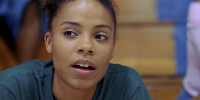 Sanaa Lathan in the movie Love and Basketball, her mouth is half open and she looks off to the side of the camera