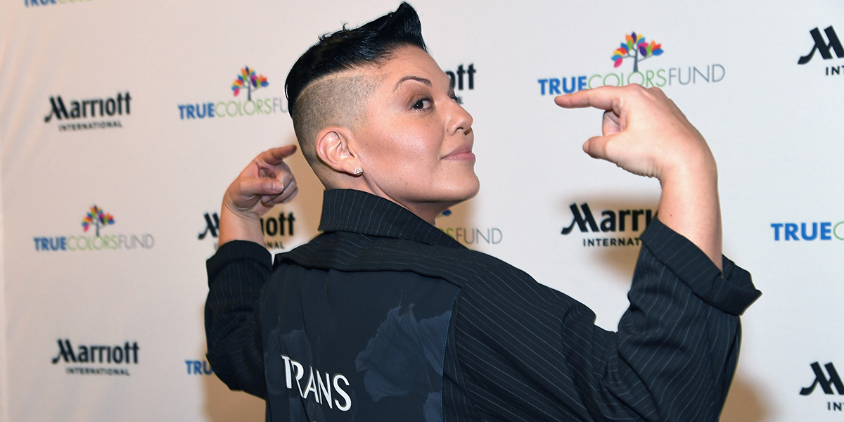 Sara Ramirez Lex profile went u today, here they are on the red carpet in a black coat that says "Trans Is Beautiful"