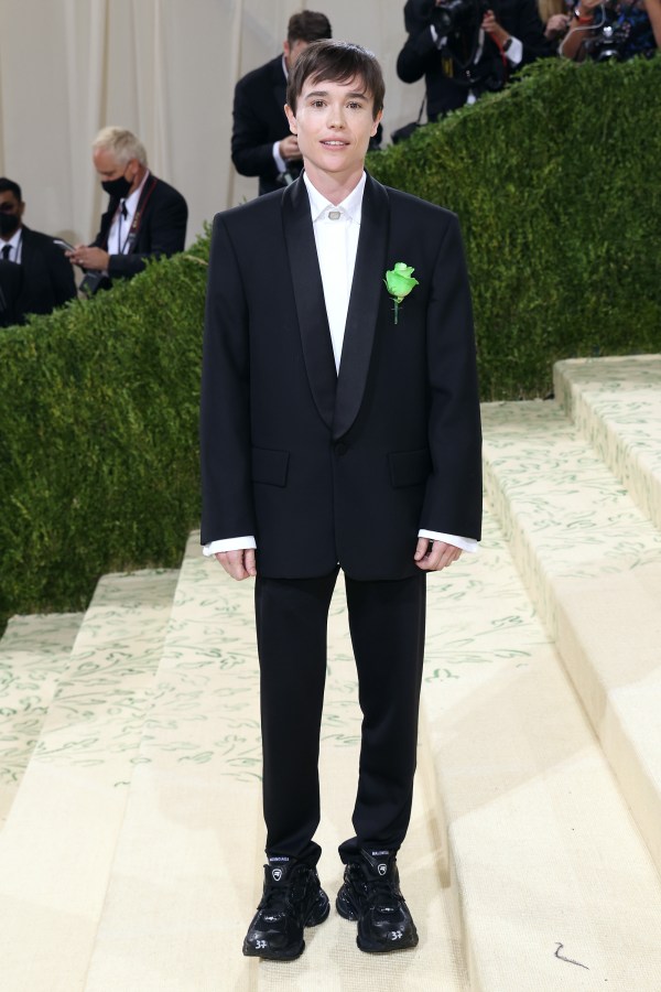 Elliott Page in a black tux and a green ribbon on his lapel