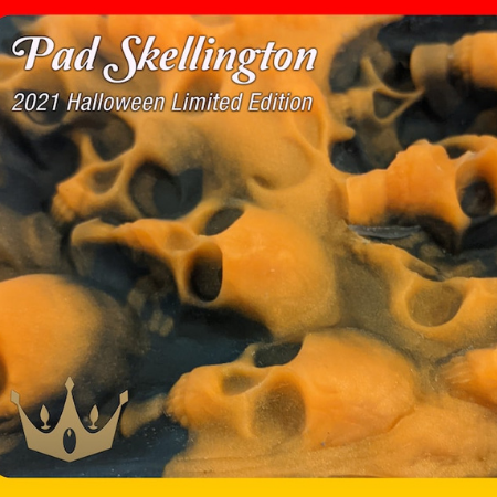 A black and orange textured silicone pad with a skull pattern; the image features the text "Pad Skellingotn, 2021 Halloween Limited Edition" on top. There is a gold crown logo in the bottom left corner.