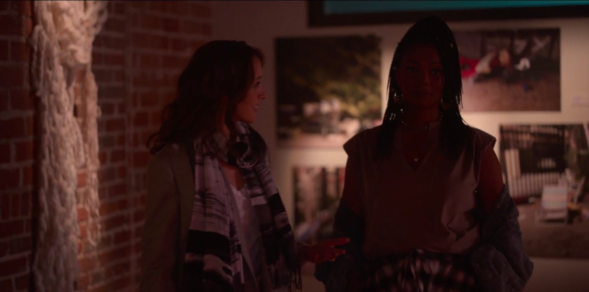 Bette and Pippa walking through the gallery