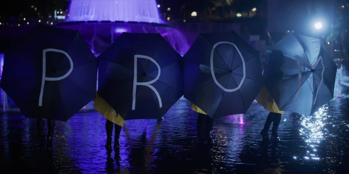 Umbrellas spell the word "PROM"