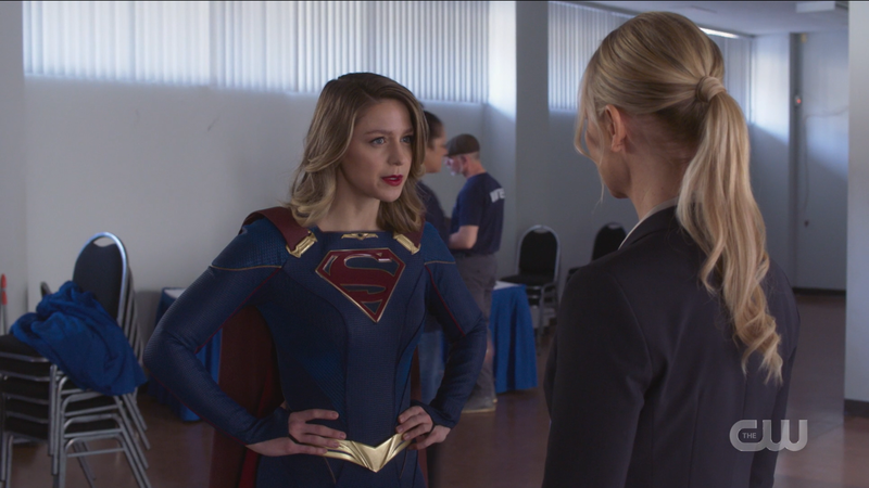 Supergirl stands with her hands on her hips looking like a white woman on twitter