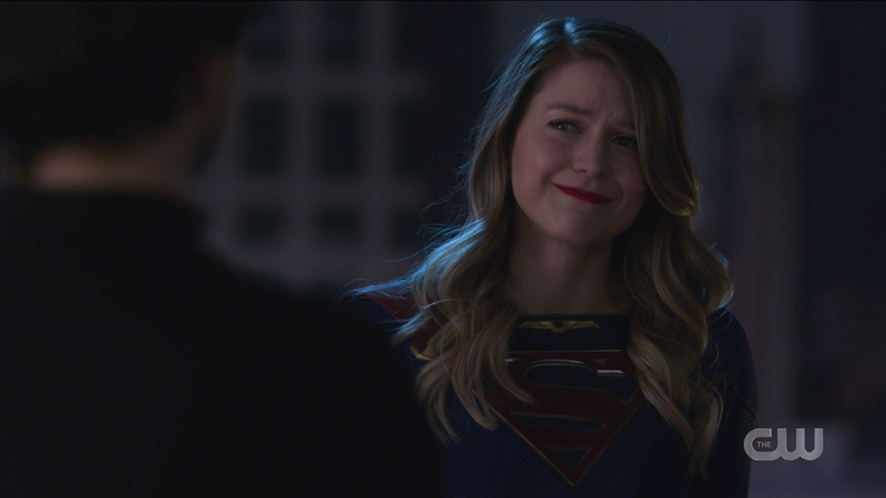 Supergirl smiles sadly at Brainy