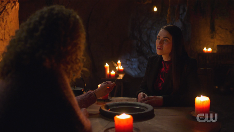 Lena looks skeptical at the magic table