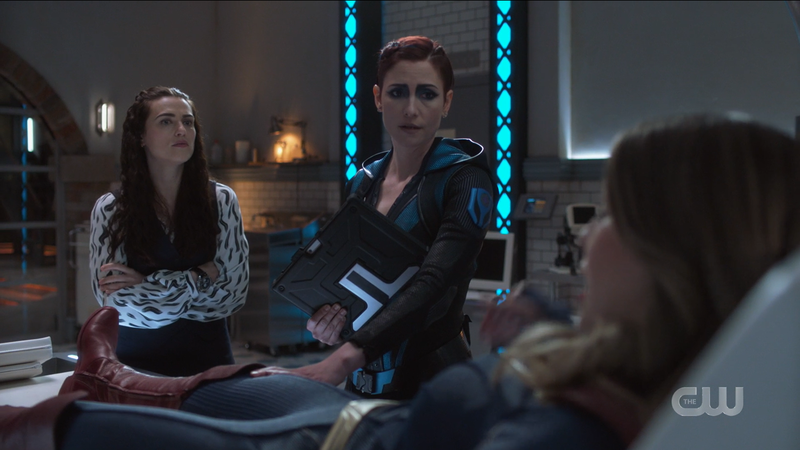 Lena and Alex look over a waking Kara