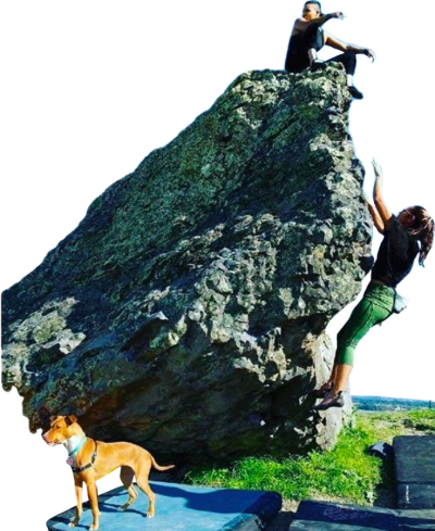 Abeni (seated at top of boulder) enjoys the view on a QTPOC climbing trip