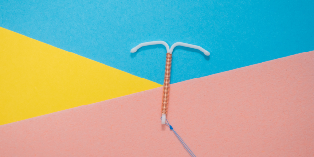 image shows IUD on a background of Yellow, Pink and Blue.