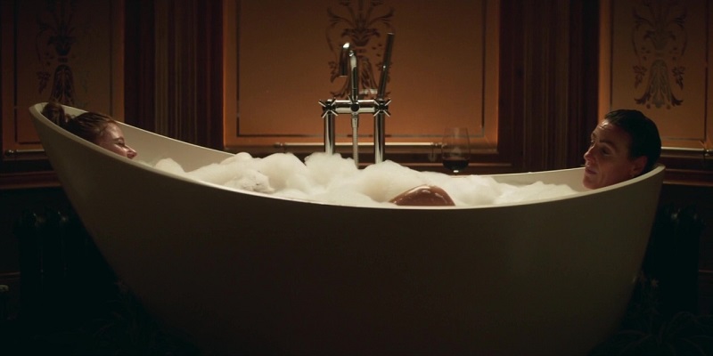 A flashback of Kirsten and Amy relaxing together in a freestanding tub filled with bubbles.