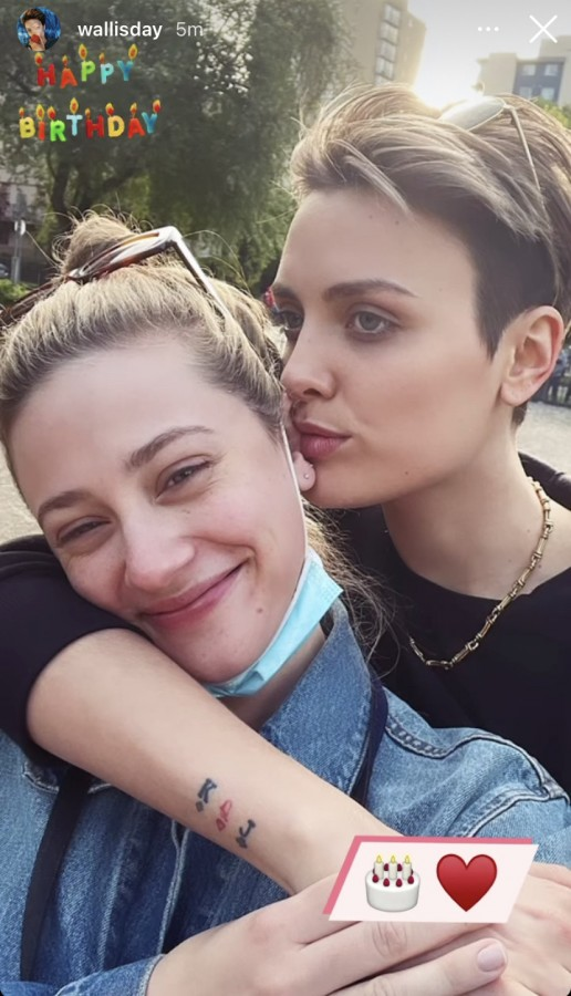 Wallis Day kissing Lili Reinhart's ear