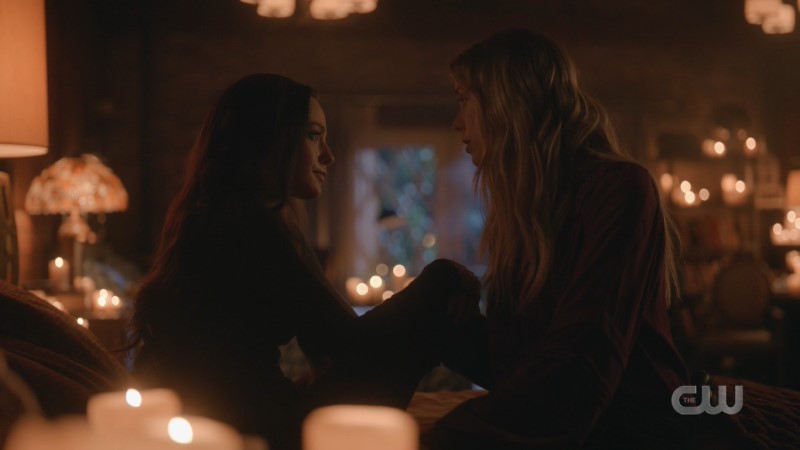 Legacies: Hope and Freya sit on a bed together