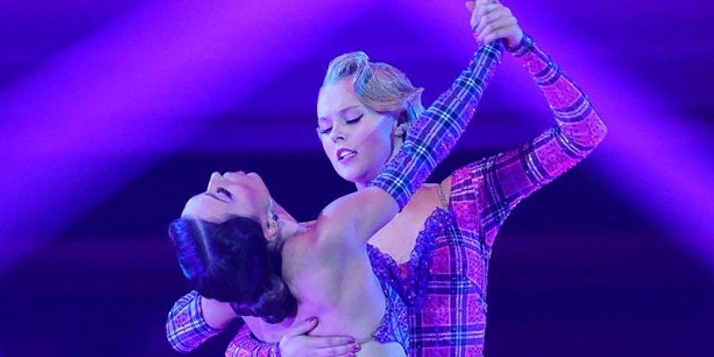 JoJo Siwa dances with her partner to Britney Spears in purple