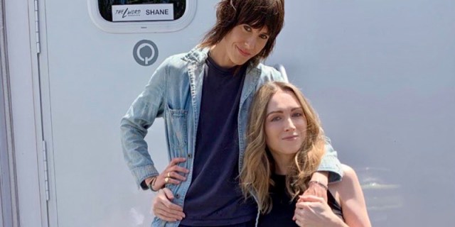 Kate Morning and Jamie Clayton pose in front of their trailer, behind the scenes of The L Word: Generation Q