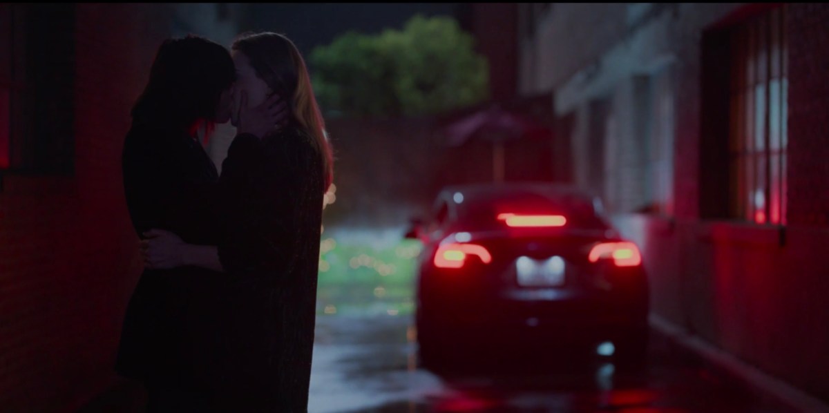 Shane and Tess kissing outside