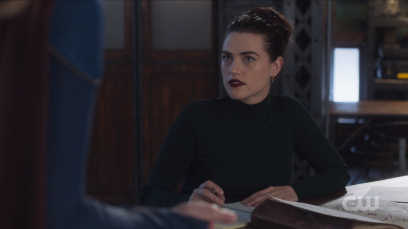 Lena looks so good in a messy bun and black turtleneck and a dark lip