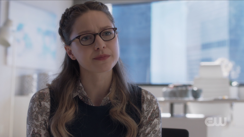 Kara looks adorkable in little half braids and a sweatervest