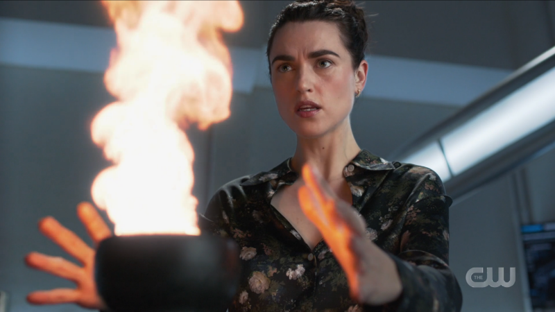 Lena watches her spell burn