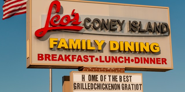 A sign reads "Leo's Coney Island: Family Dining" against a blue sky