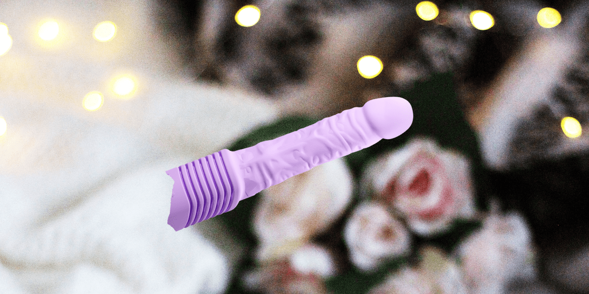 Sex toy gift guide: Image shows a purple dildo with ridges at the bottom overlaid on a photo of roses and Christmas lights.