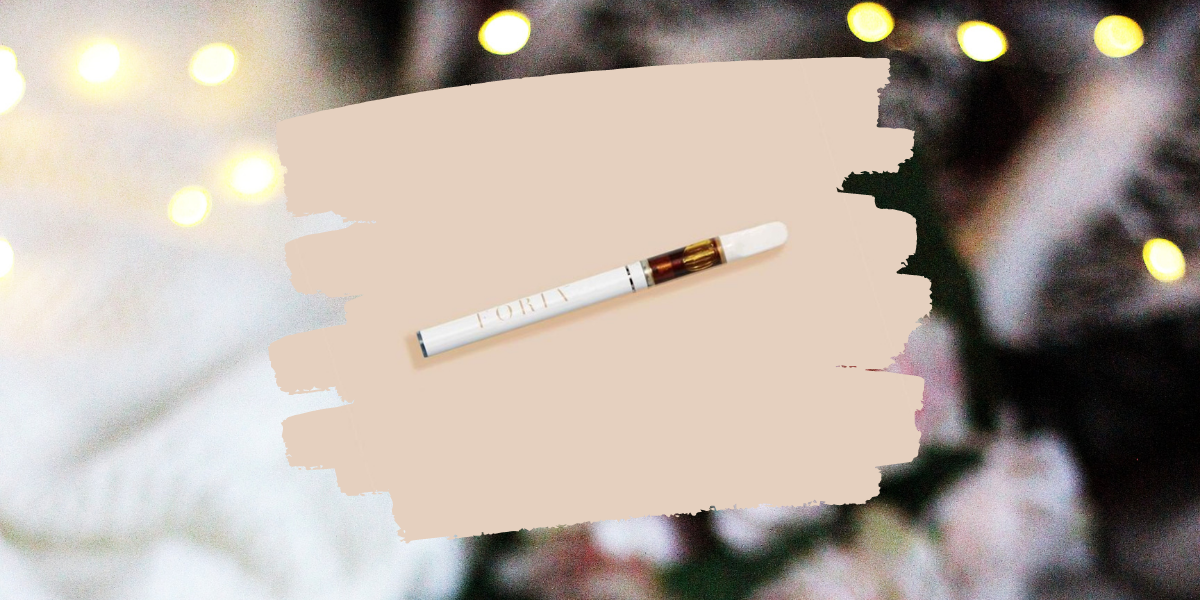 Image shows a white vape pen overlaid on a photo of roses and Christmas lights.