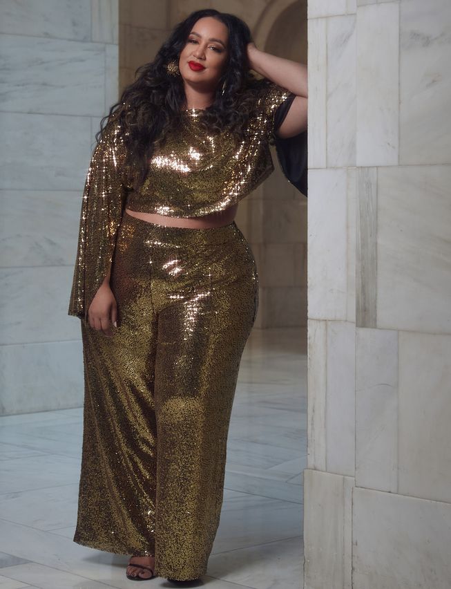 Holiday Lookbook For Fat Femmes: A person in a gold sequen pant and top set