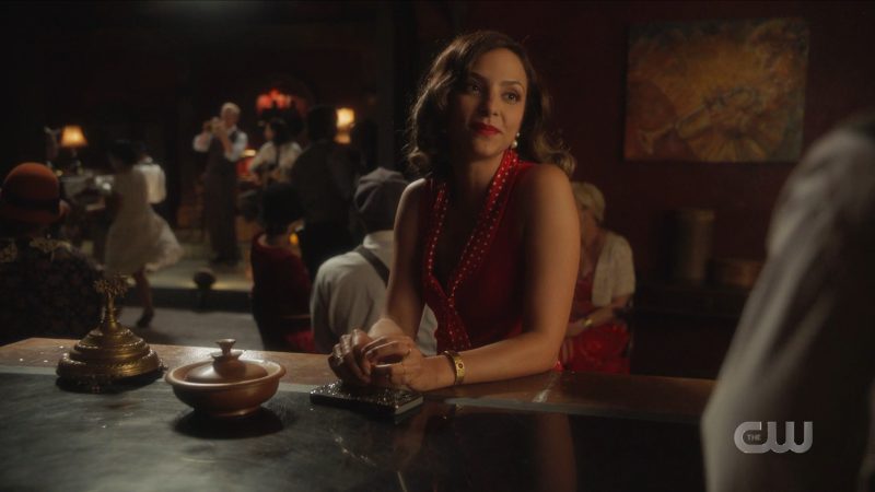 Zari sits at the bar looking quite lovely