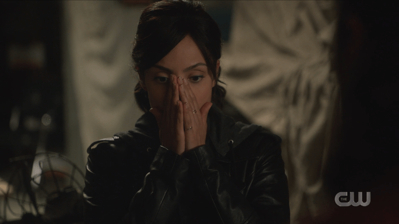 Zari puts her hands to her face in a gasp of surprise