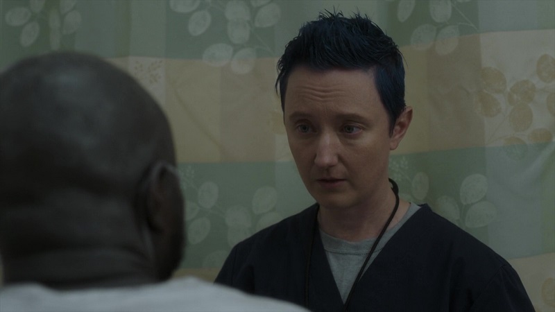 Nurse Kai talks to his patient, Temi, about removing his binder, leaning on their shared experiences as trans men.