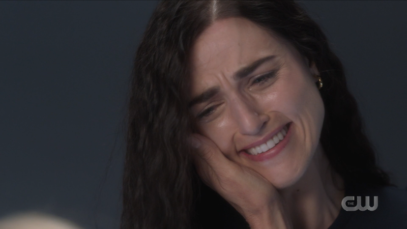 Lena cries into Lillian's hand