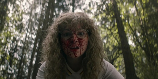 Yellowjackets 102 Recap screenshot of Misty with blood spatter on her face in the woods