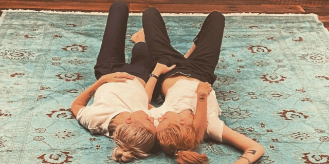 Kristen Stewart and Dylan Meyer, who recently became engaged, cuddling on the floor in matching outfits