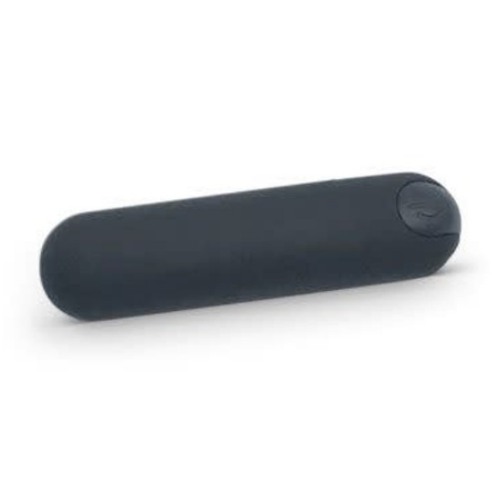 A black bullet vibrator with a power button on one end is against a white background.