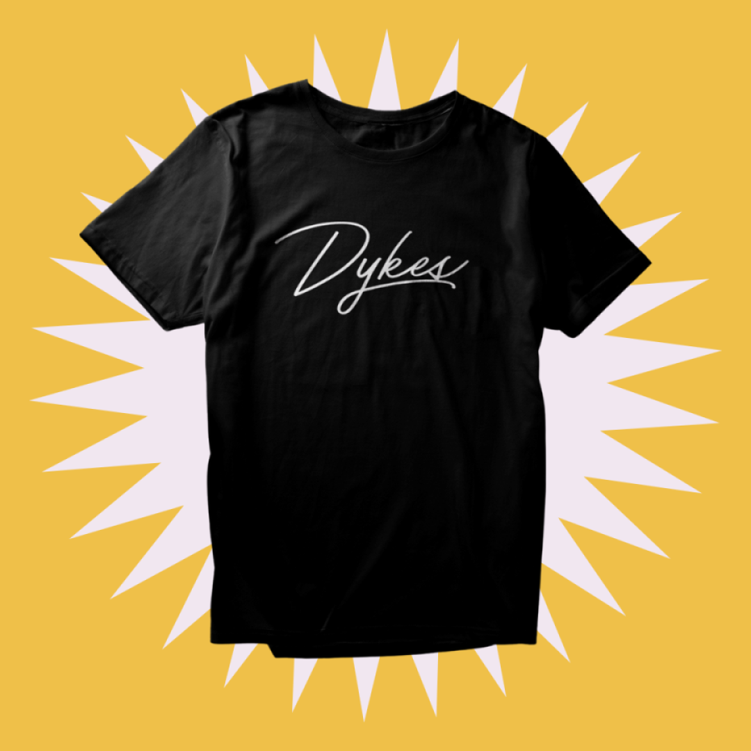 Our Team Dykes Tee on a yellow and pink background.