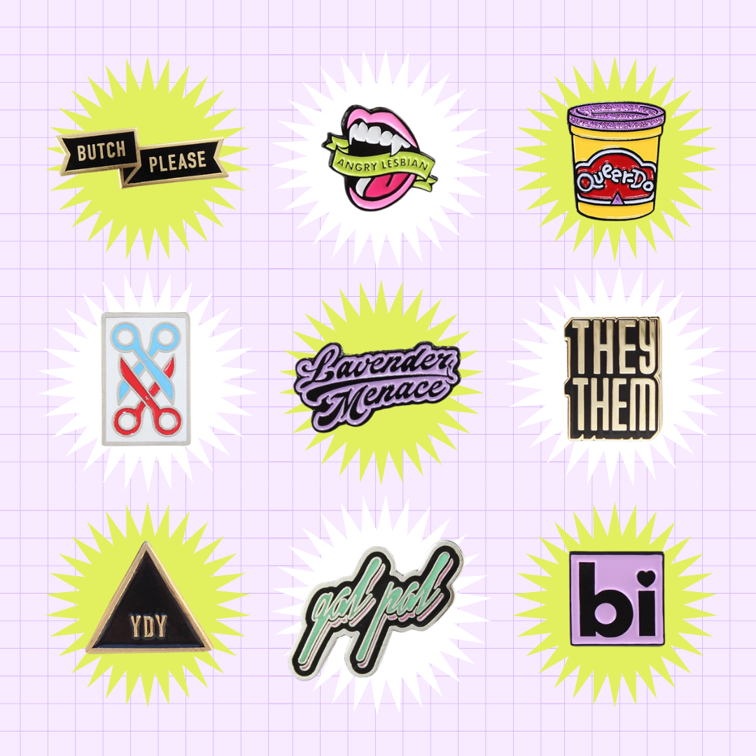 A collection of enamel pins from the Autostraddle Store. Butch Please, Angry Lesbian, Queerdo, Scissoring, Lavender Menace, They/Them, You Do You, Gal Pal, Bi