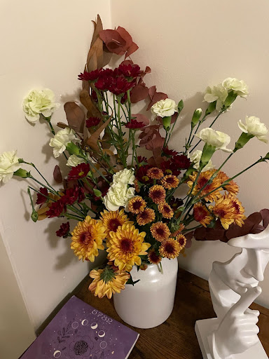 a vase filled with gorgeous fresh flowers inside ari's home