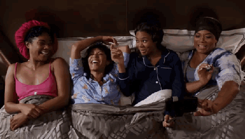 A gif of the cast of girl's trip laughing