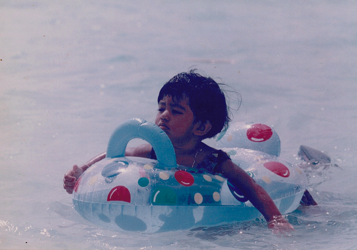 eman, the author, as a child in the ocean