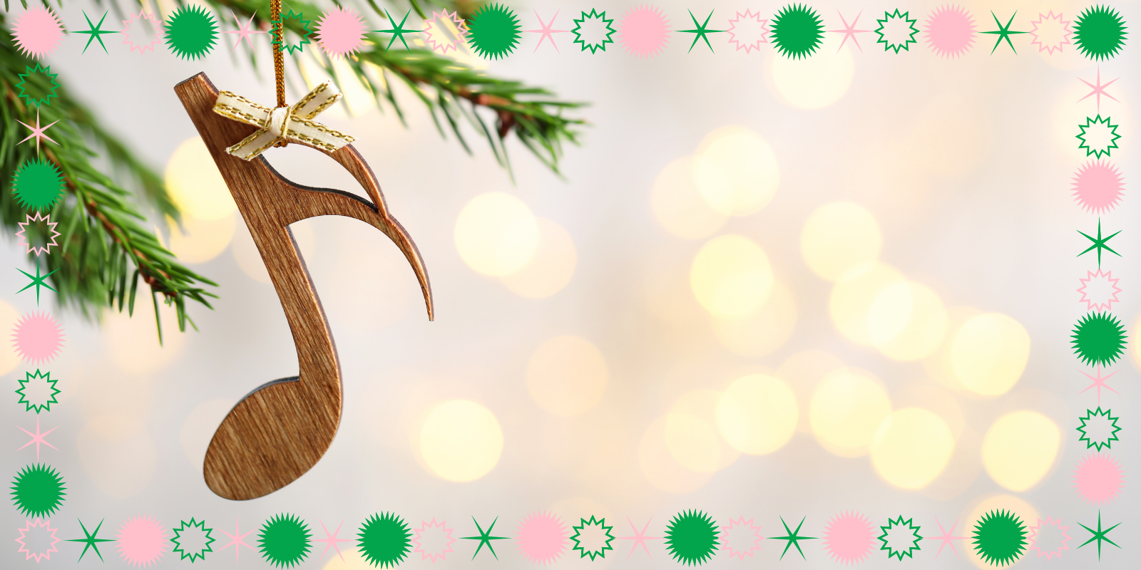 a music note ornament hanging from a christmas tree with sparkling lights in the background