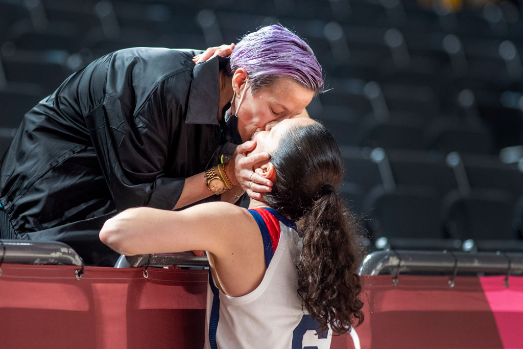 TOKYO, JAPAN August 8: Sue Bird #6 of the United States is congratulated with a kiss from her fiancee US soccer player Megan Rapinoe after the United States victory during the Japan V USA basketball final for women at the Saitama Super Arena during the Tokyo 2020 Summer Olympic Games on August 8, 2021 in Tokyo, Japan. (Photo by Tim Clayton/Corbis via Getty Images)